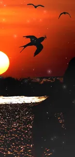 Vibrant sunset with birds and glowing sun over water.