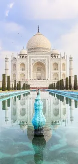 Taj Mahal reflecting in calm water under a blue sky.