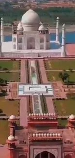 Aerial view of the Taj Mahal with lush gardens and historic architecture.