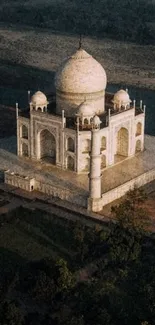 Aerial view of the Taj Mahal at sunrise, showcasing its majestic beauty.