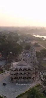 Aerial view of a temple at sunset with soft pastel colors.