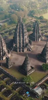 Aerial view of ancient temple complex surrounded by greenery.