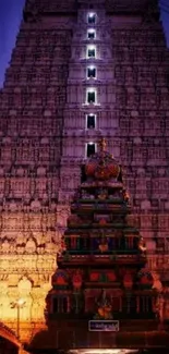 Majestic view of a brightly lit temple at night showcasing intricate architecture.