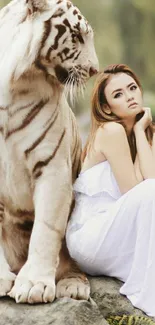 Majestic white tiger beside a serene woman on rocks.