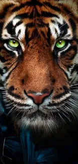 Close-up of tiger with striking green eyes on a mobile wallpaper.