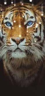 Majestic tiger with blue eyes surrounded by glittering stars on a dark background.