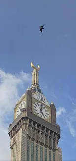 Majestic clock tower set against a vibrant blue sky with a bird flying above.