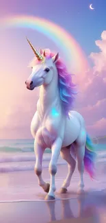 Majestic unicorn on a beach with a rainbow in the background.