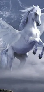 Majestic unicorn with wings in a misty, mystical scene.