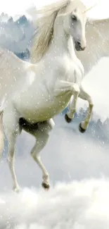 Majestic unicorn flying through snowy sky on mobile wallpaper.