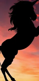 Unicorn silhouette in a vibrant sunset sky, creating a magical and enchanting scene.