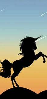 Unicorn silhouette with gradient sky background on a mobile wallpaper.