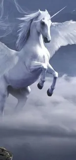 Majestic unicorn flying in cloudy sky wallpaper