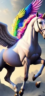 Majestic unicorn with rainbow wings in a mountain setting.