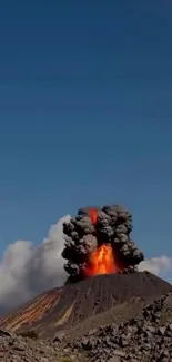A dramatic volcanic eruption under a clear blue sky.