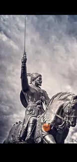 Warrior statue on horseback with dramatic sky.