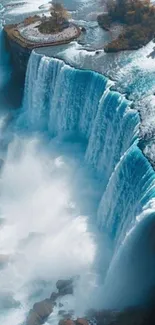 A stunning aerial view of a majestic waterfall with powerful water flow.