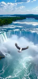Majestic waterfall with an eagle soaring above in clear blue skies.