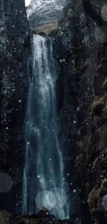 Majestic waterfall flowing through frosty, rugged cliffs with a wintery charm.