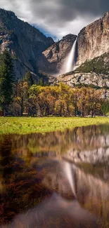 Majestic waterfall in Yosemite with a vibrant reflection.