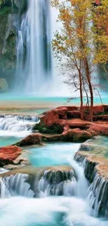 Majestic waterfall with turquoise water and autumn trees.