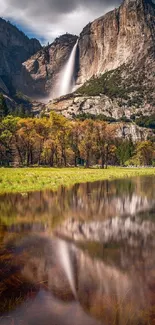 Scenic mobile wallpaper featuring a majestic waterfall and lush green landscape.