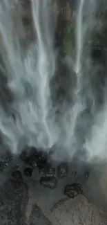 Majestic waterfall cascades over rocks.