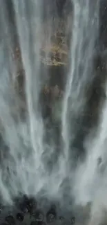 Majestic waterfall cascading down the rocks, creating a tranquil scene.