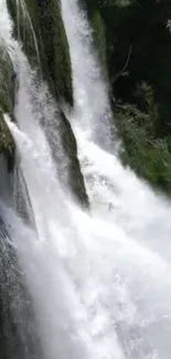 A tranquil waterfall cascading down lush greenery.