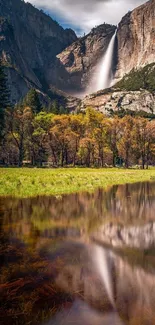 Majestic waterfall with a mountain and reflective pool landscape.