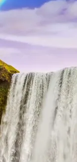 Majestic waterfall with rainbow in nature.