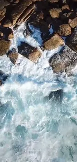 Ocean waves crashing on rocky shoreline wallpaper.