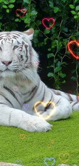 White tiger resting on lush green grass with leafy backdrop.