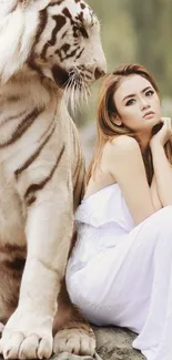 A white tiger and woman in a peaceful setting, ideal for a serene wallpaper.