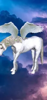 Winged unicorn in blue clouded sky wallpaper.