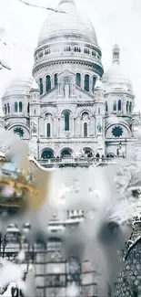 Snow-covered Sacré-Cœur Basilica in winter.