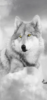 Majestic wolf with yellow eyes amidst clouds.