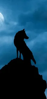 Wolf silhouette against a moonlit sky.