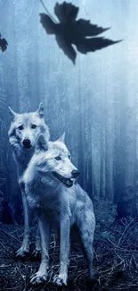 Two majestic wolves stand in a blue-lit forest with falling leaves.