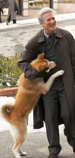 Man in winter coat with dog in urban snowy setting.