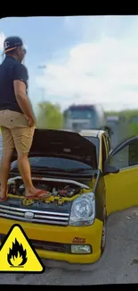 Man stands on yellow car bonnet on a road with open doors and caution sign.