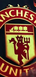 Manchester United emblem on fiery background.