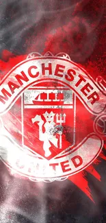 Manchester United emblem on red and black mobile wallpaper.