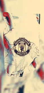 Manchester United logo on artistic mobile wallpaper.