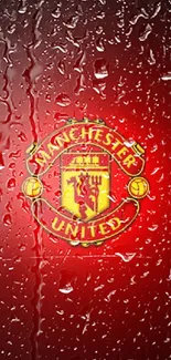 Manchester United logo on a red background with water droplets.