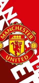 Manchester United crest on red wallpaper with bold letters.