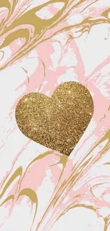 Gold glitter heart on marble background.