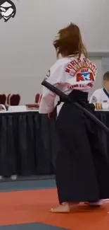 Martial artist in traditional attire, ready for competition.