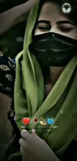 A woman wearing a green hijab and black mask.