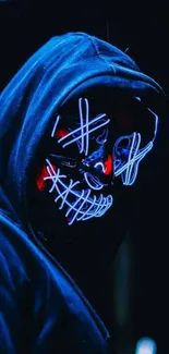 Neon mask with glowing lines in dark hood.